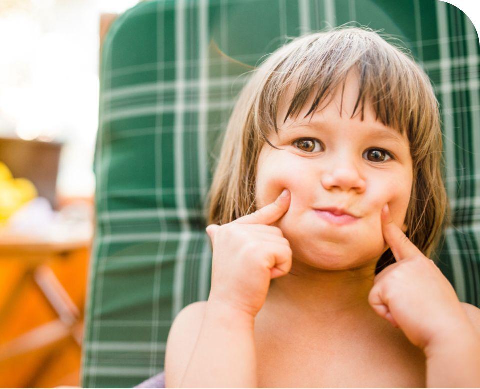 Little child touching cheeks at Jubilee